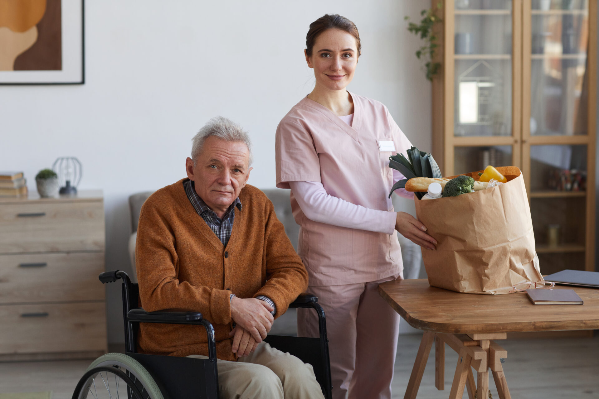Prestige Care Connect-Darford-Caregiver-and-senior-arriving-home-from-grocery-shopping.