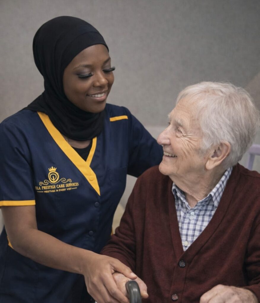 Caregiver assisting elderly person with walker.